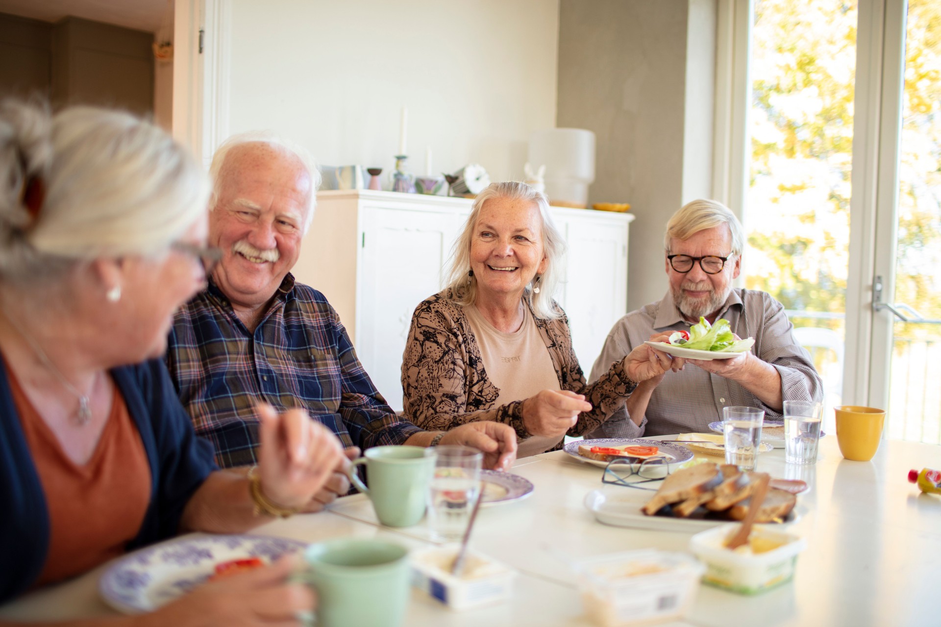 Small group of seniors having breakfast together Small group of seniors having breakfast together